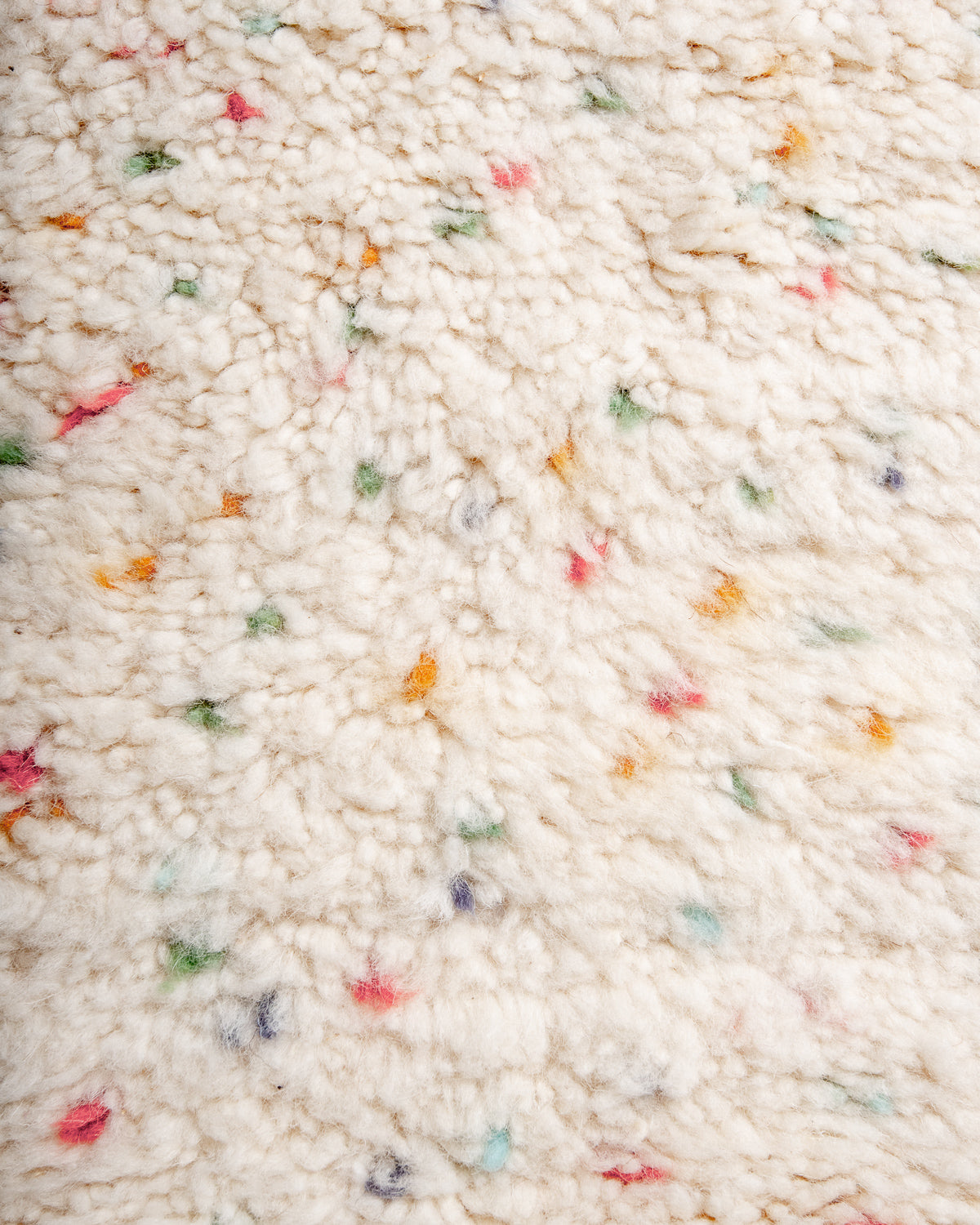 Modern, designer, handcrafted Berber rug from Morocco. Beniourain carpet with beautiful colours and patterns and fluffy wool texture.